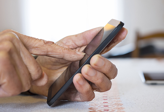 Senior woman Using mobile phone at home